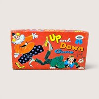 A horizontal vintage board game box for "Up and Down Game" by Whitman. Features two whimsical clowns in colorful costumes against a vibrant red background. Matte paper texture with visible edge wear and aged patina.