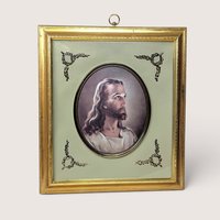 Framed Warner Sallman Head of Christ portrait in an oval matte with decorative corner flourishes and a gold frame.