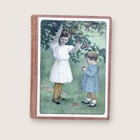 An antique children's book with a large color lithograph pastedown on the front cover depicting two young girls in an orchard against a neutral background.