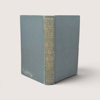 Antique book titled The Life of Robert Browning by Edward Dowden with a faded blue cloth cover and an ornate gold gilt decorated spine.