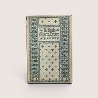 A vintage hardcover book with a cream and teal green patterned cover featuring crosses and floral borders, titled The Soul's Sincere Desire by Glenn Clark.