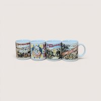 A yellow vintage box containing a set of four white ceramic mugs, each featuring a different colorful vintage circus poster illustration.