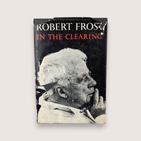 Distressed dust jacket of a 1962 Robert Frost poetry book titled In the Clearing featuring a black and white portrait.