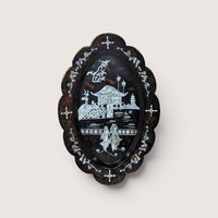 An oval black lacquer tray with mother-of-pearl inlay depicting an Asian landscape, centered on a beige background.