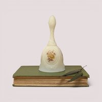 Vintage cream-colored Fenton cameo satin glass bell featuring a hand-painted yellow and chocolate brown rose.