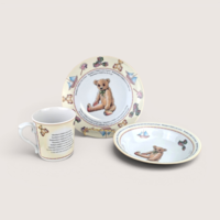 A three-piece children's porcelain set with teddy bears and nursery rhyme text, centered on a beige background.