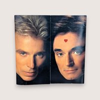 A vintage square souvenir program book for Siegfried and Roy at The Mirage.