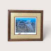 A framed vintage wildlife print titled "Set on the Wing" depicting a flying pheasant, centered on a beige background.