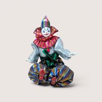 A colorful sitting clown doll with a painted porcelain head, metallic silver sleeves, and striped balloon pants.