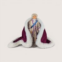 Vintage Peggy Nisbet King Louis XVI portrait doll wearing a white embroidered suit and a plush burgundy velvet robe.