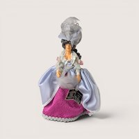 Vintage Peggy Nisbet Renoir portrait doll in an ornate lavender and pink gown with an elaborate feathered hat.