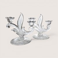 Pair of vintage Duncan Miller clear glass two-light candelabras with a delicate floral etched design on the oval bases.