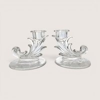 Pair of vintage Fostoria clear glass cornucopia scroll candlestick holders with delicate floral etching on the bases.