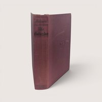 A 1929 first American printing hardcover edition of The Embezzlers by Valentine Kataev bound in textured maroon cloth.