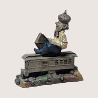 Vintage Tom Clark Cairn studio gnome figurine depicting a gnome named "Cole" wearing an acorn-cap hat, seated on top of a miniature trolley car or train passenger car numbered 22, resting on a base of textured leaves and acorns, centered on a plain linen background.