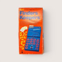 Vintage 1977 Schaper Finders Keepers matching game box in bright orange with retro blue graphics.