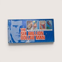 Vintage 1975 Parker Brothers The Six Million Dollar Man board game in its original blue illustrated bionic character box.