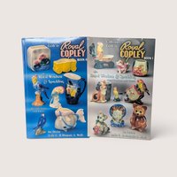 Two vintage pottery reference book covers side by side showing colorful planters and figurines on a plain background