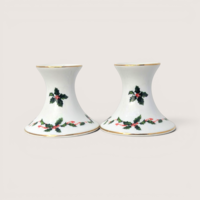 Pair of vintage Lefton white ceramic candlestick holders decorated with holly berries and a gold rim.