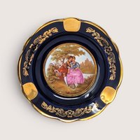 Vintage Limoges cobalt blue porcelain ashtray with a gold-gilded border and a center Fragonard courting couple scene.