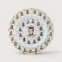 10 inch vintage ceramic collector plate featuring US presidents in a ring around John F. Kennedy.