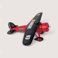 Vintage 1990s Ertl NASCAR Travel Air Model R Mystery Ship die-cast airplane coin bank in red and black livery with box.