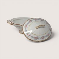 Antique Elite Works Limoges porcelain covered vegetable bowl with pink floral swags and gold trim, shown with its lid resting beside it.