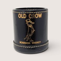 Vintage black leather Old Crow Bourbon Whiskey promotional dice cup embossed with gold foil lettering and crow mascot.