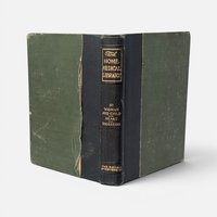 Vintage 1907 hardcover copy of The Home Medical Library with a dark spine and green covers.