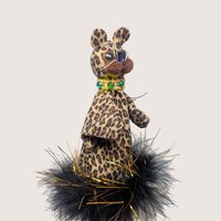Vintage handmade felt leopard stick puppet in leopard print with a black feather boa collar and wooden rod.