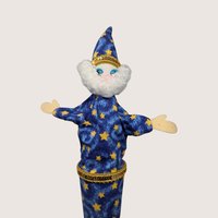 Vintage handmade cloth wizard puppet in a blue star-print robe with a fluffy white beard and gold trim.