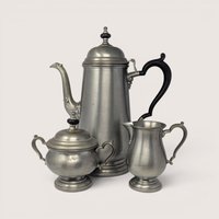 Vintage Three-Piece Oneida Heirloom Pewter Tea Set including teapot, sugar bowl, and creamer.