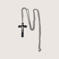 Vintage black and silver-tone crucifix pendant necklace on a long continuous chain.