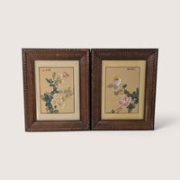 Pair of vintage Asian wood framed botanical and bird art prints with carved frames.