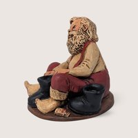 Vintage Santa Putting On Boots Resin Christmas Figurine