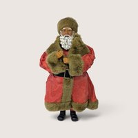 Vintage Russ standing Santa Claus figurine in a red coat with brown faux fur trim.