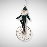 1992 Charlene Smith Signed Metal Ornament of Santa on a Unicycle