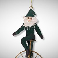 1992 Charlene Smith Signed Metal Ornament of Santa on a Unicycle
