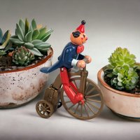 Vintage Plastic Clown on Bicycle Wind-Up Toy: Whimsical Collectible
