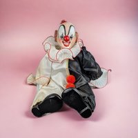 Porcelain Musical Sitting Clown Doll: Whimsical Melody and Delightful Decor