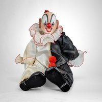 Porcelain Musical Sitting Clown Doll: Whimsical Melody and Delightful Decor
