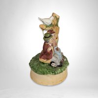 Artmark Ceramic Swinging Older Couple Music Box - Sentimental Melodies of Togetherness