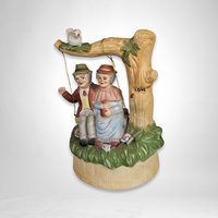 Artmark Ceramic Swinging Older Couple Music Box - Sentimental Melodies of Togetherness