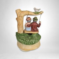 Artmark Ceramic Swinging Older Couple Music Box - Sentimental Melodies of Togetherness