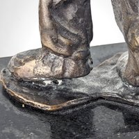 Swingin' Statue: Bronze Horn Player Blows Away in Vintage Charm