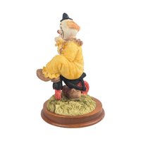 Vintage Waving Clown Figurine: Bicycle Rider