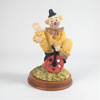 Vintage Waving Clown Figurine: Bicycle Rider