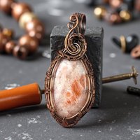 Handmade Copper Wire Wrapped Sunstone Pendant: Artisan Gemstone Jewelry