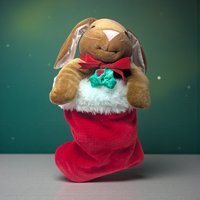 1985 Rabbit Ears Plush Rabbit in Stocking. Measures about 20" total length. The rabbit comes out of the stocking. Good condition. Rabbit has a slight pink hue on chest.