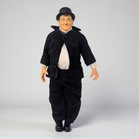 A vinyl character doll of comedian Oliver Hardy featuring his iconic bowler hat, black suit, and mustache. The figure has a rounded physique and visible joints at the elbows and knees.